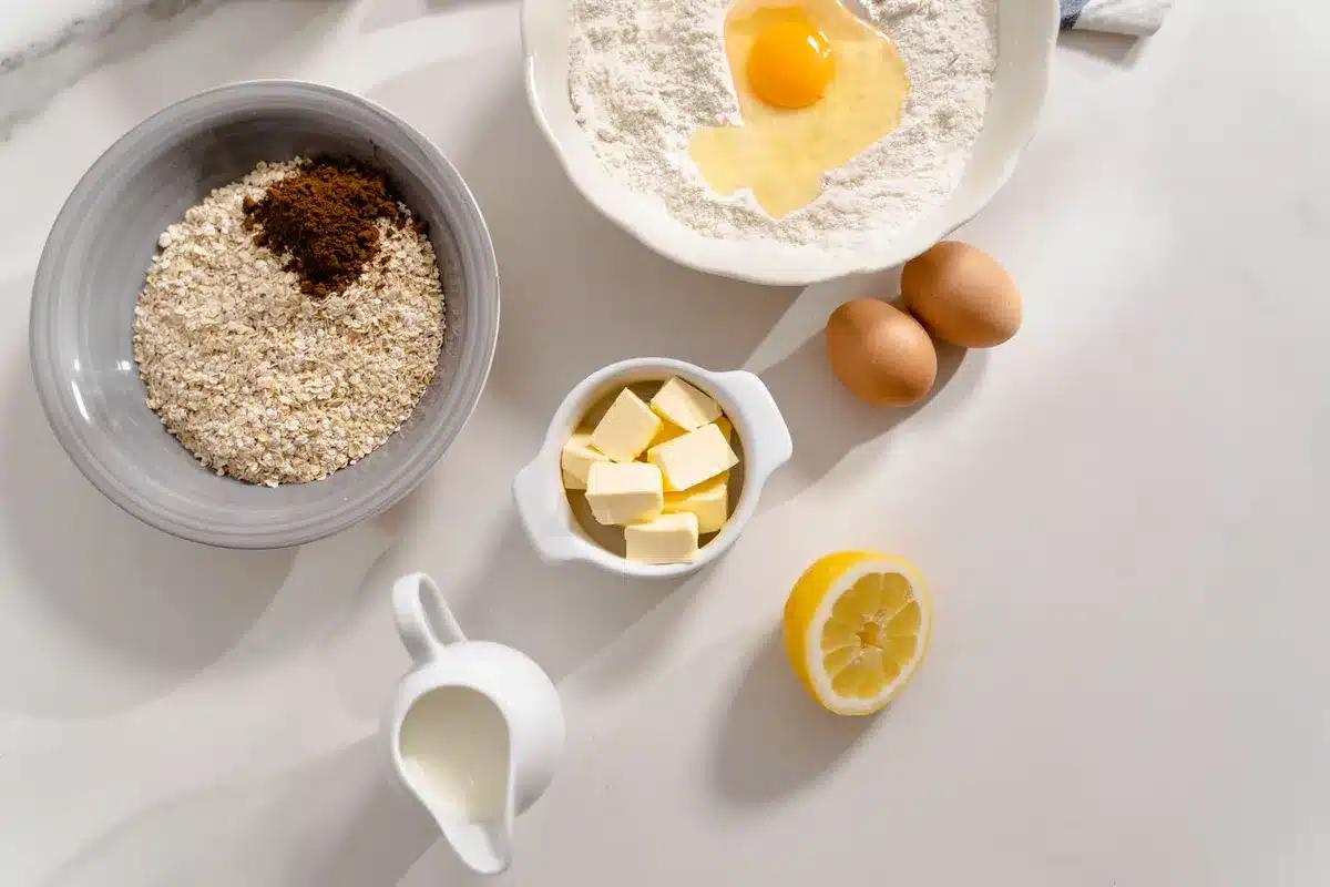 Ingredients mixed together for oat crisp topping: oats, flour, brown sugar, and melted butter