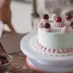 Freshly baked cherry cobbler with golden topping and bubbling fruit filling in a baking dish