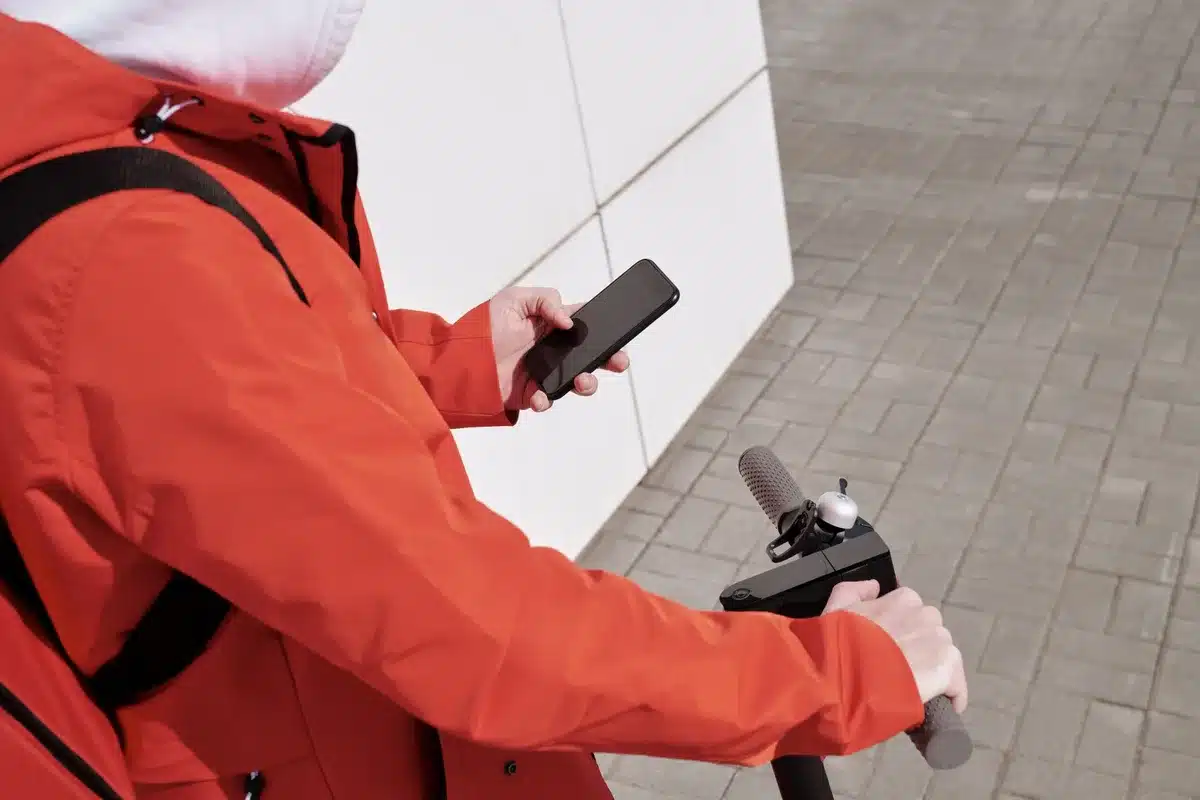 Londoners exploring autonomous vehicle booking options on a smartphone app