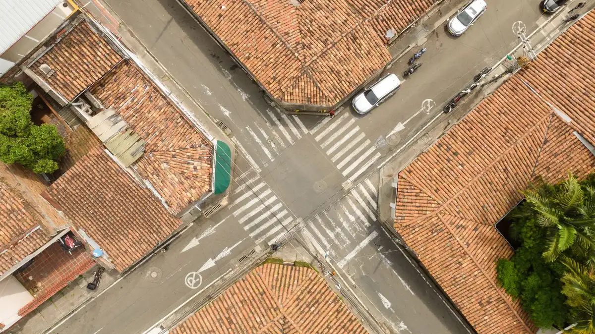 Autonomous taxi navigating a busy London street with pedestrians and cyclists nearby