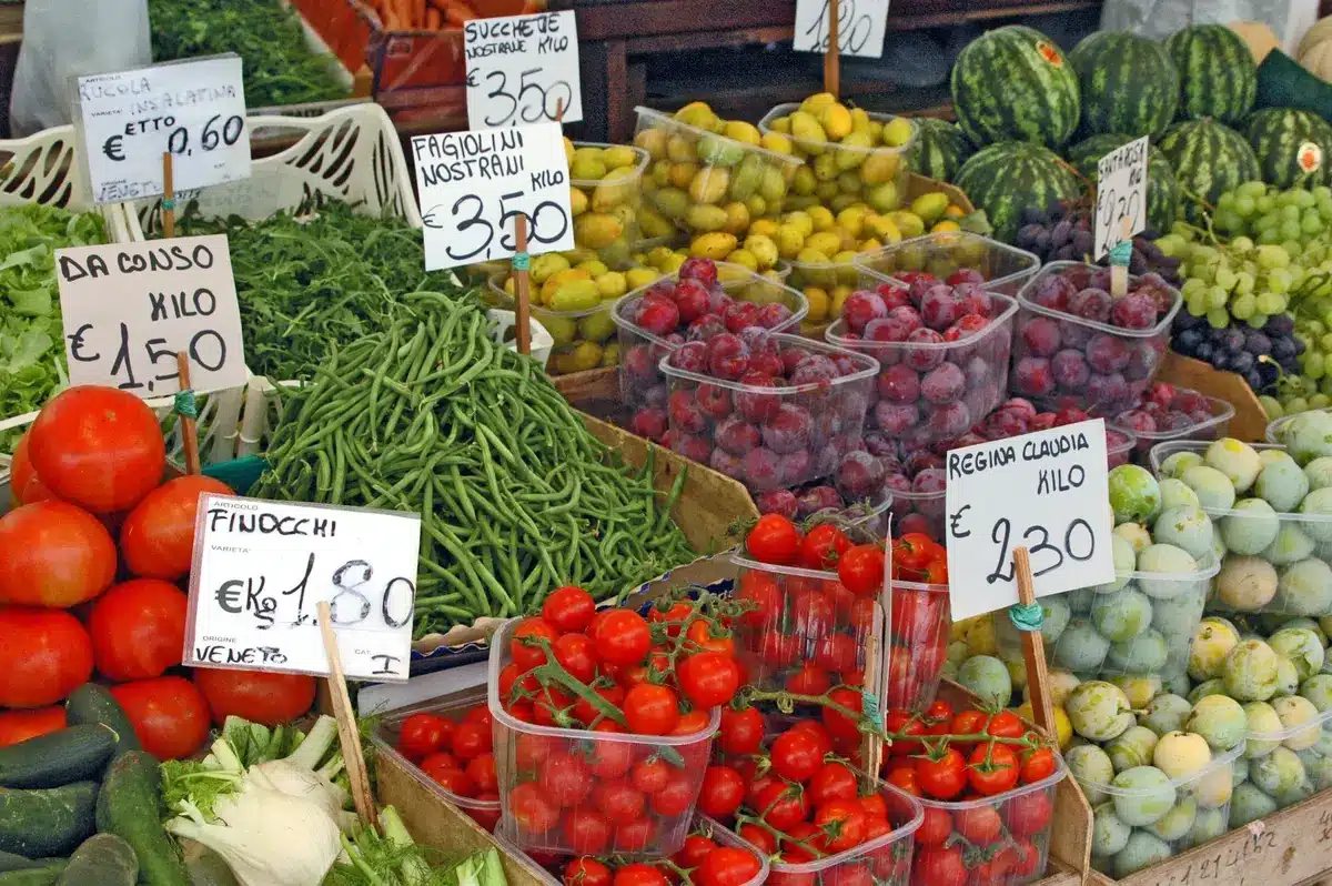 Colorful vegetables, fruits and whole grains arranged on a plate