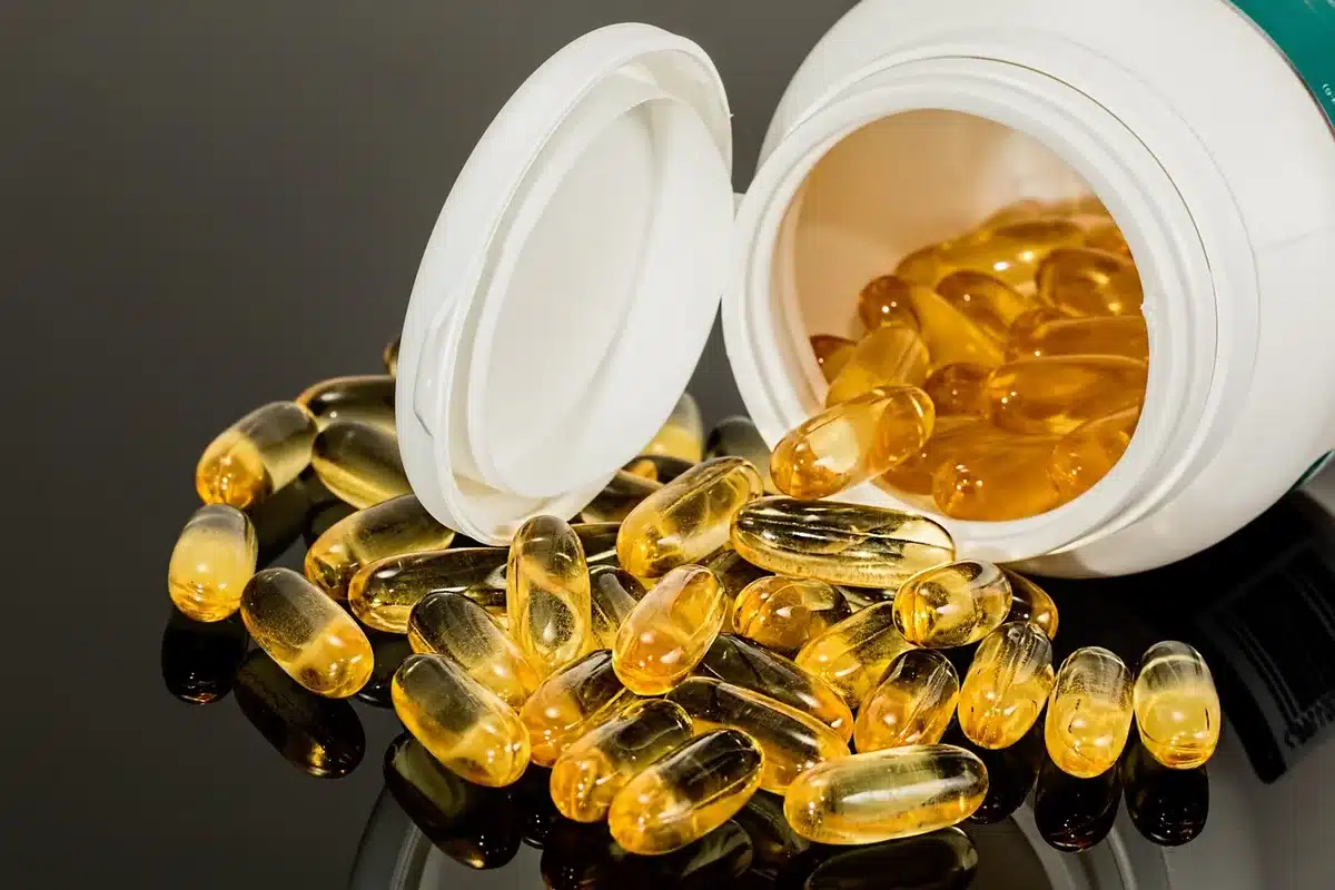 Multiple medication bottles and pills arranged together, representing drug interactions and safety concerns