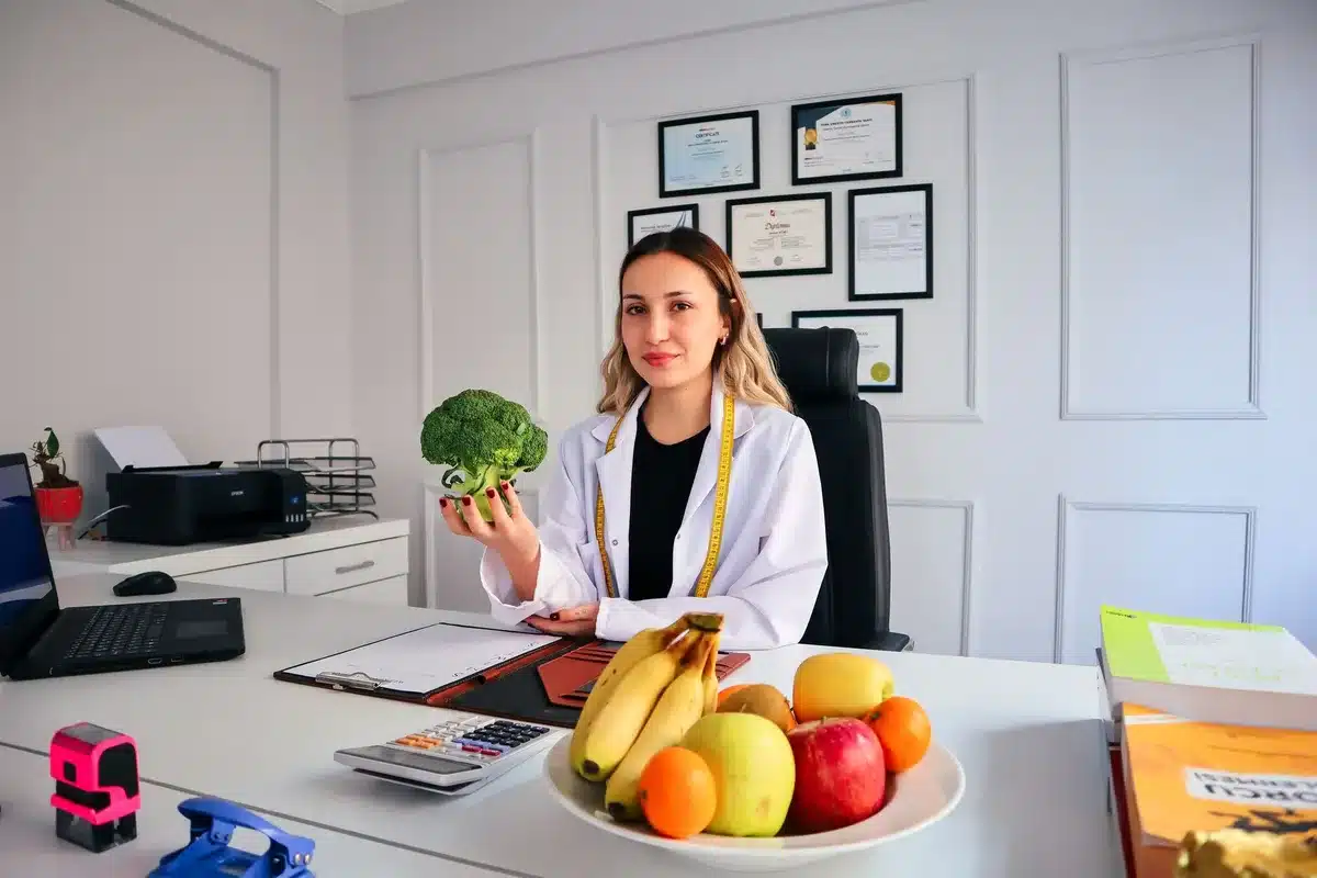 Medical professional reviewing nutrition information at a desk