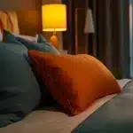 Cosy bed with soft pillows and sheets in natural morning light