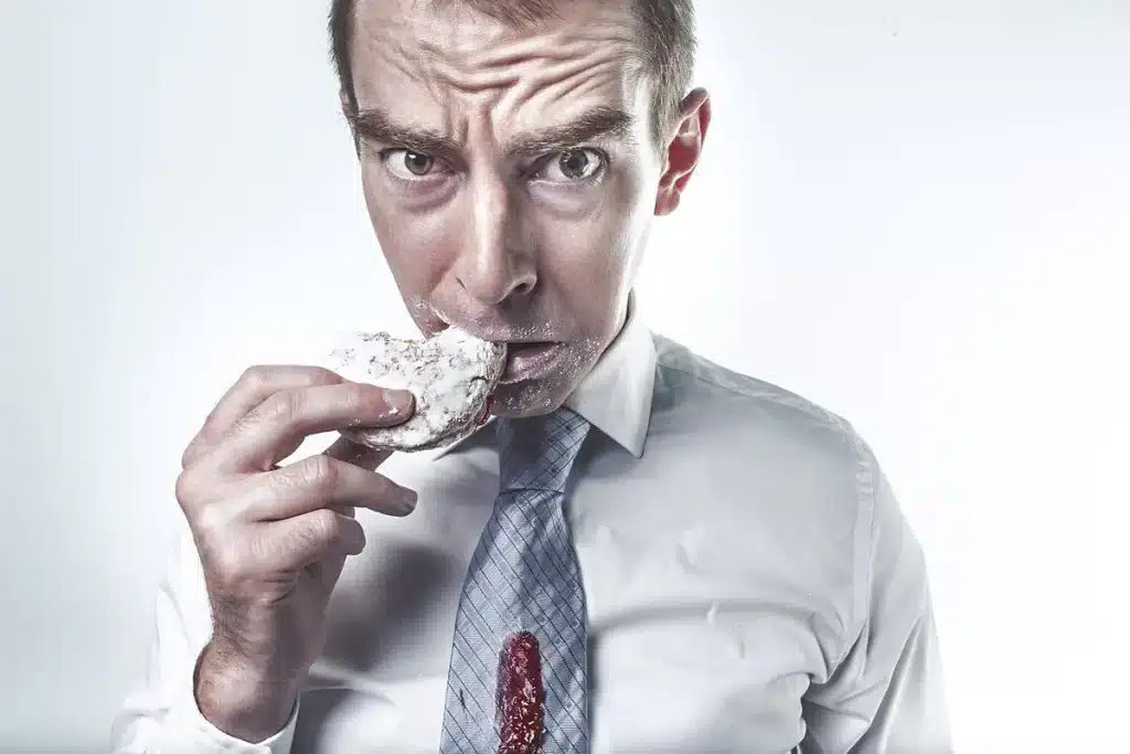 Supermarket biscuit aisle in daylight with boxed biscuit packs on shelves