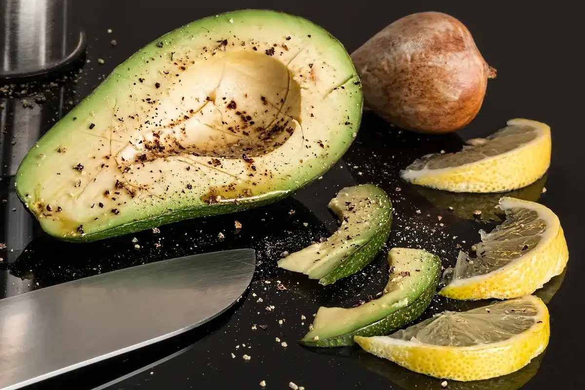 Cut avocado showing its creamy interior and pit, highlighting its nutrient-rich composition