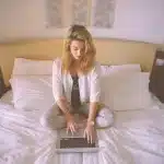 Home medical monitoring devices including a smartphone, weight scale, and blood pressure cuff on a bedside table in a ru