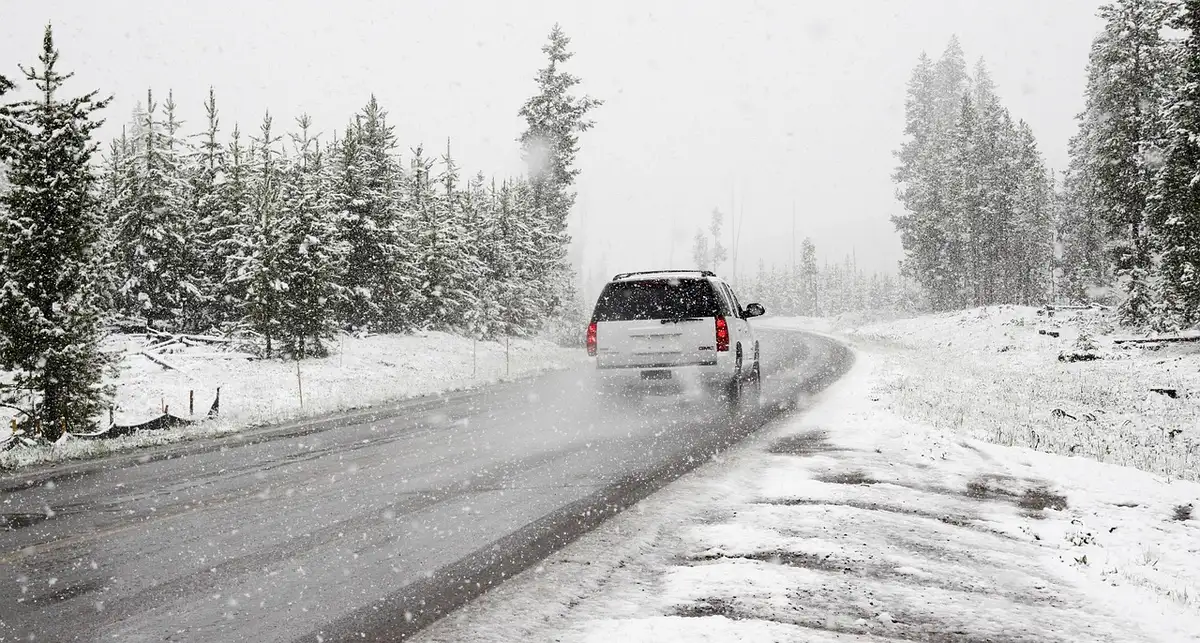 Hybrid SUV driving on open road highlighting performance and range