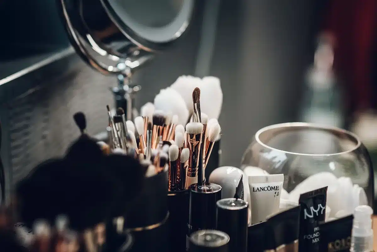 Compact makeup kit with portable mirror, LED light, and travel-sized cosmetics for mobile application