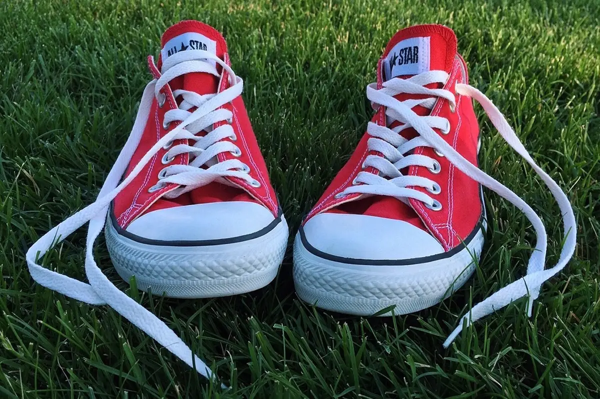 Supportive shoes and cushioned insoles beside feet