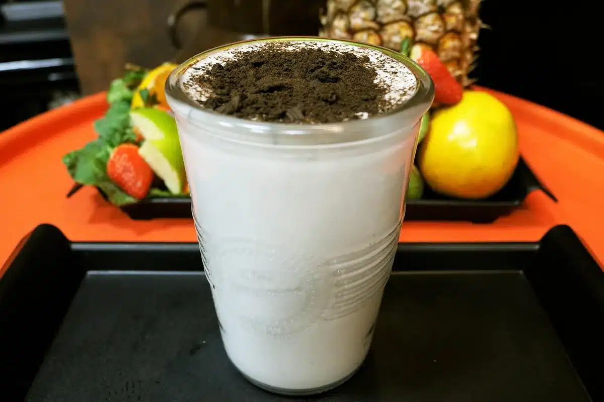 A selection of plant-based milks and low-fat yogurt alternatives on a bright kitchen table