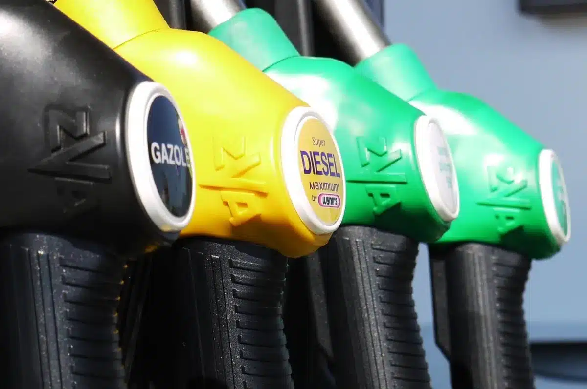 Motorists at a petrol station forecourt in daylight representing fuel duty discussion