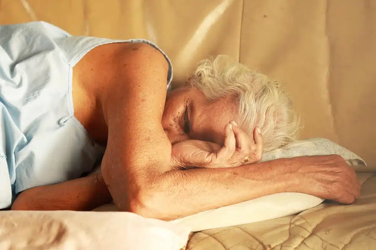 Bright bedroom with made bed and soft blanket ready for a 90-minute nap