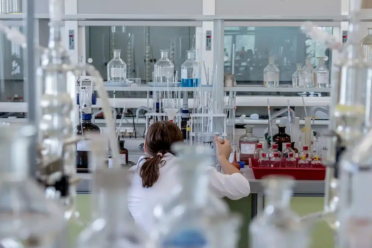 Vials and lab equipment representing mRNA and protein vaccine technologies