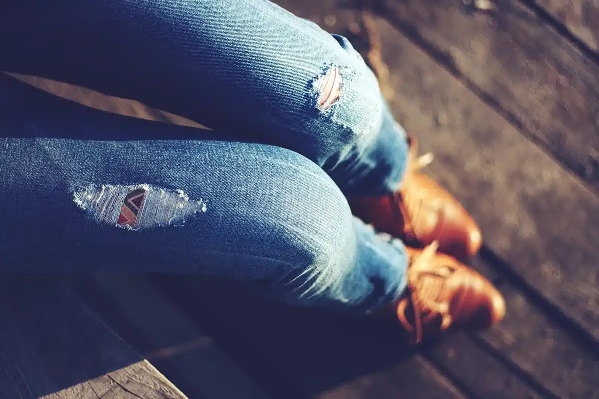 Wide-leg jeans paired with a structured blazer and loafers in daytime