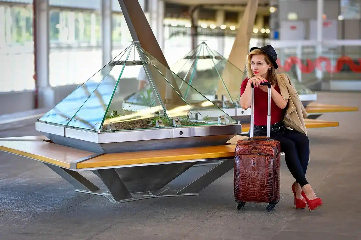 Open suitcase with comfortable clothes and prescription medications laid out