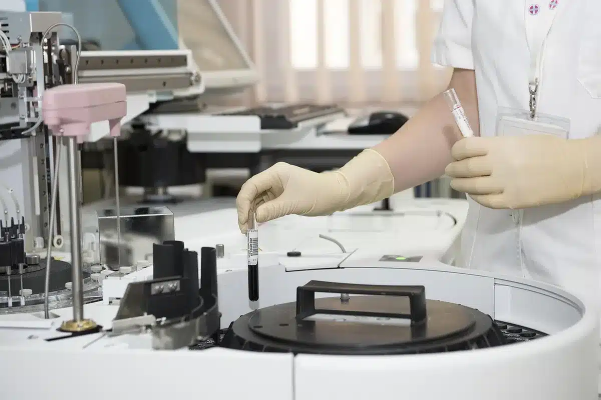 Researchers reviewing clinical trial graphs and papers on a table