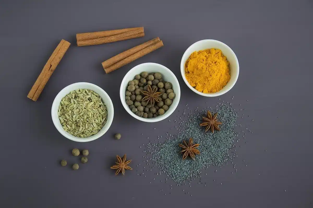Bowl of pumpkin purée with cinnamon and nutmeg on a bright kitchen table