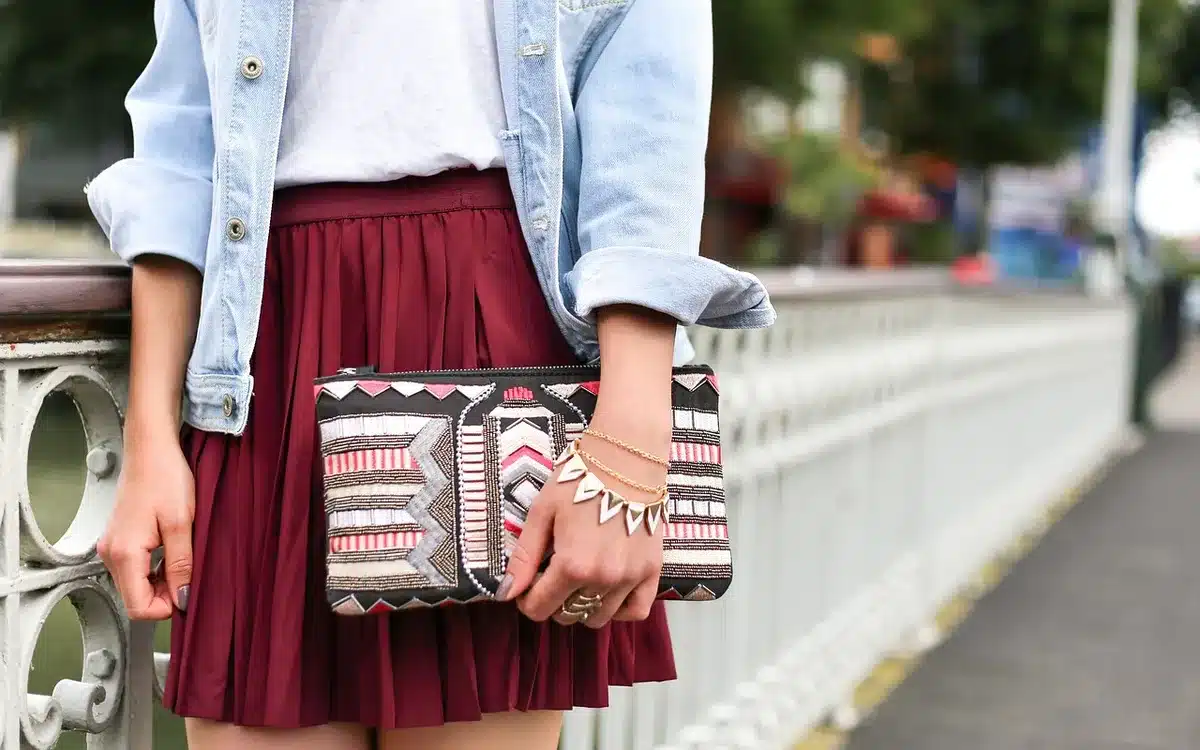 Flat lay of pumps paired with a midi skirt and accessories for styling ideas